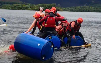 Group of people sailing on a raft