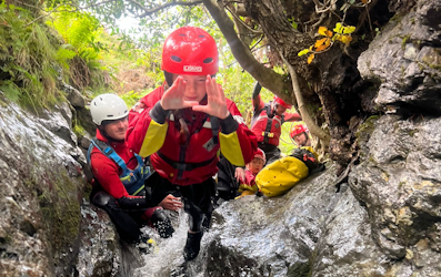 Boy diving into a pool in a ghyll