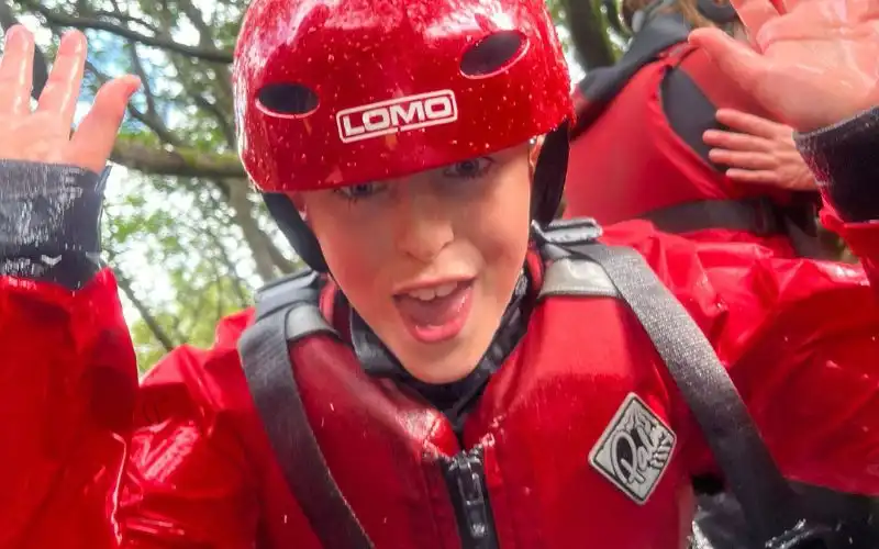 A child enjoying a school trtip with keswick adventures